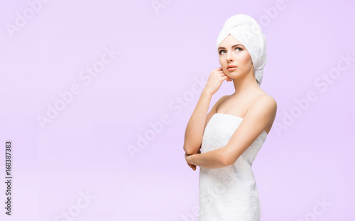 Young, beautiful and natural woman in towel. Spa concept with copyspace.