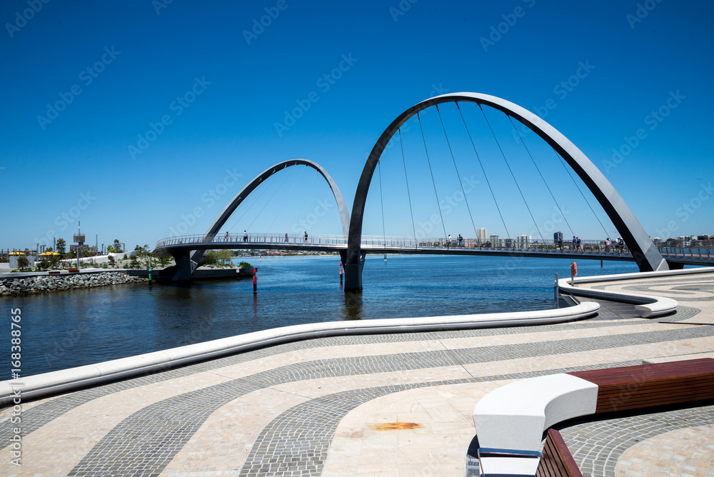 People walking across Elizabeth Quay Bridge in Perth City