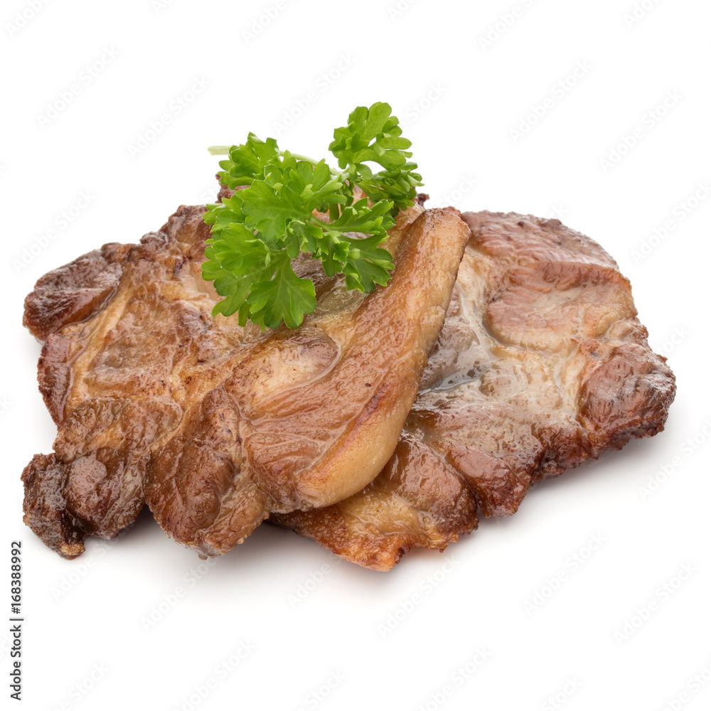 Cooked fried pork meat with parsley herb leaves garnish isolated on white background cutout Cooked fried pork meat with parsley herb leaves garnish isolated on white background cutout