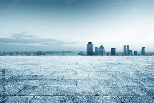 cityscape and skyline of hangzhou from empty brick floor