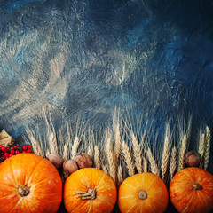 Basket with fresh apples and pears on a wooden table. Autumn background.