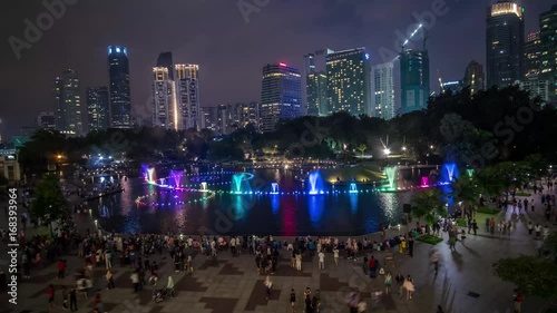 KUALA LUMPUR - MAY 6: A 4K footage of Symphony Lake, Kuala Lumpur City Centre water show through the glass window view on May 6, 2017 in Kuala Lumpur.