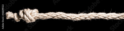 Ship rope with knot isolated on black background. With copy space text. Studio Shot.