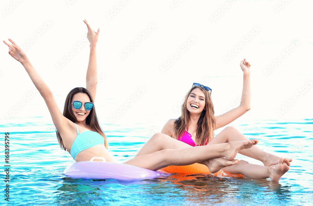 Beautiful young women in bikini at sea resort