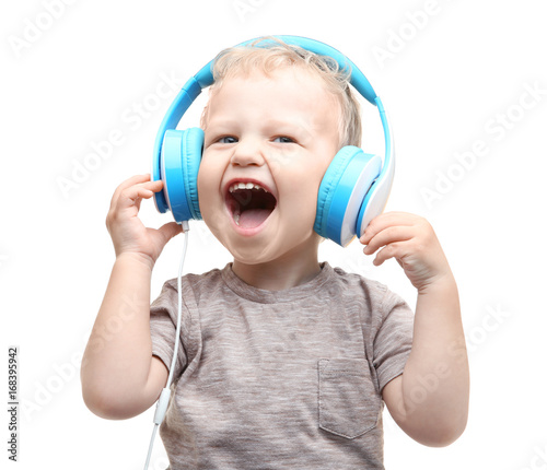 Cute little boy with headph...
