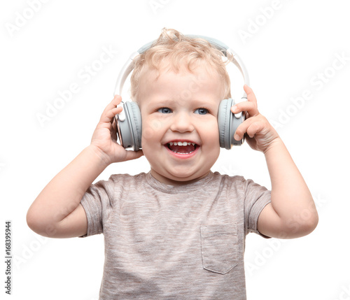 Cute little boy with headph...