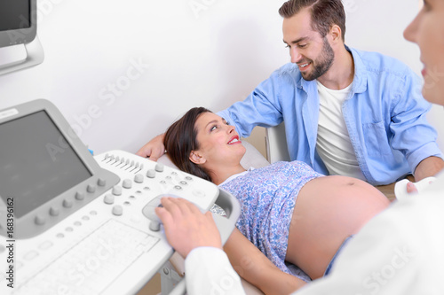 Young pregnant couple under...