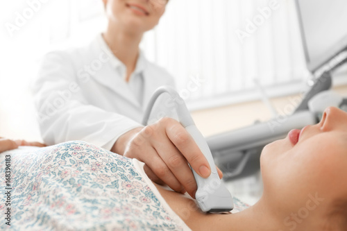 Doctor conducting ultrasoun...