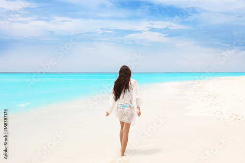 Beautiful young woman on sea beach