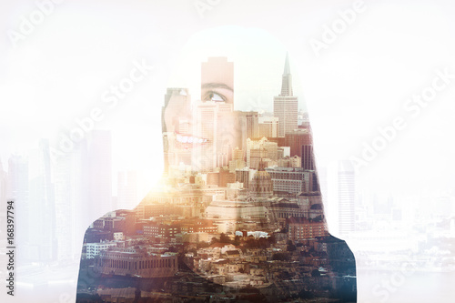 Smiling woman in city multiexposure