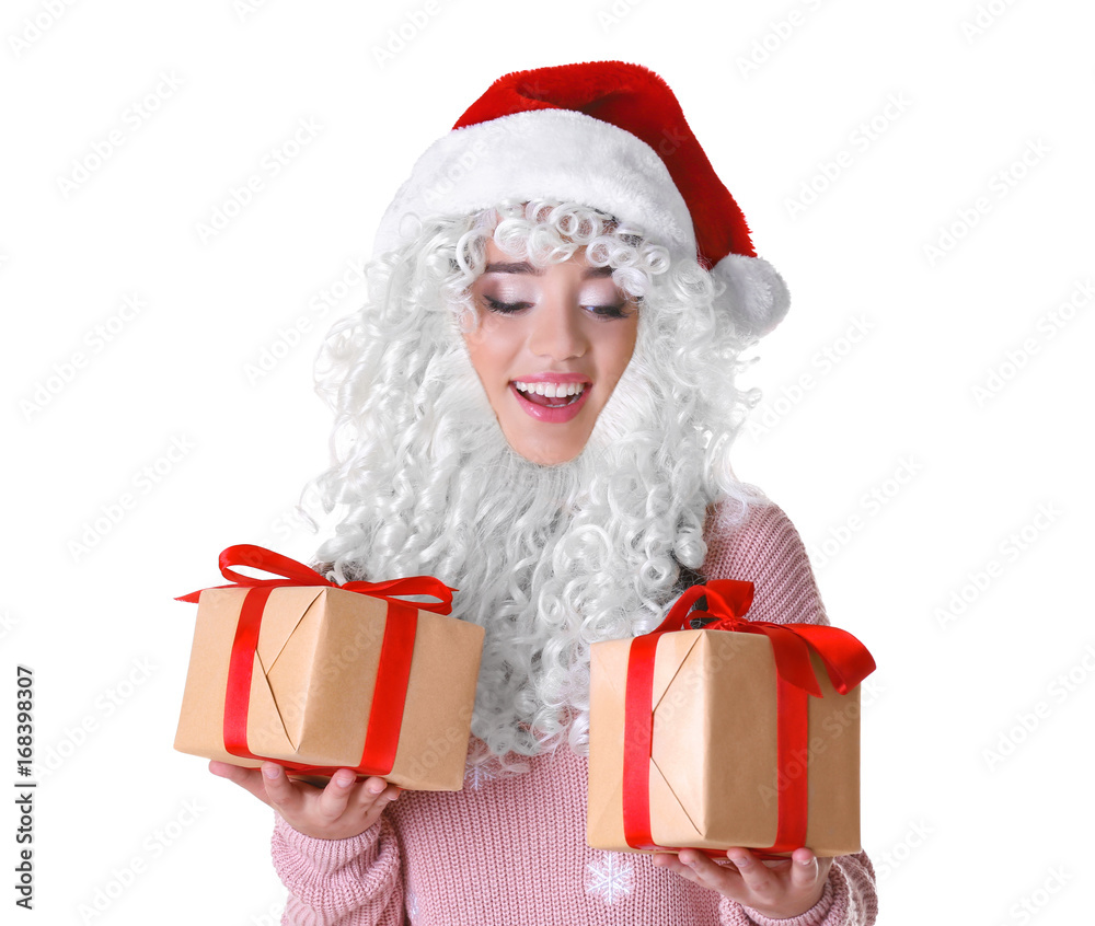 Attractive lady in Christmas hat and fake Santa Claus beard holding gift boxes on white background Attractive lady in Christmas hat and fake Santa Claus beard holding gift boxes on white background