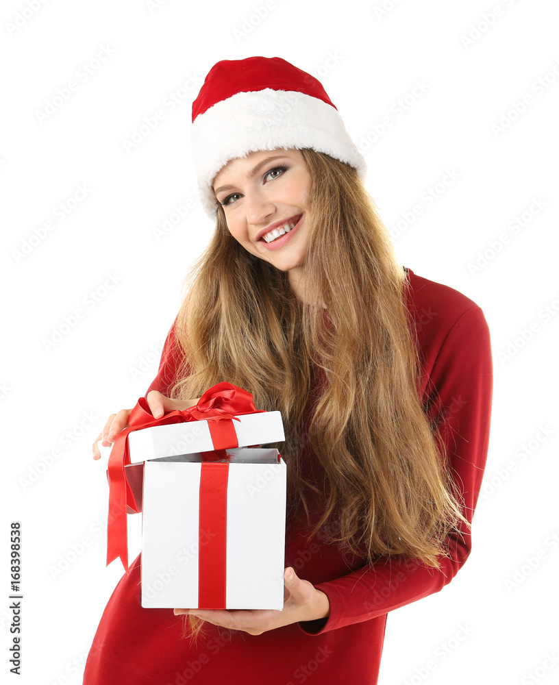Beautiful lady in Christmas hat opening gift box against white background Beautiful lady in Christmas hat opening gift box against white background