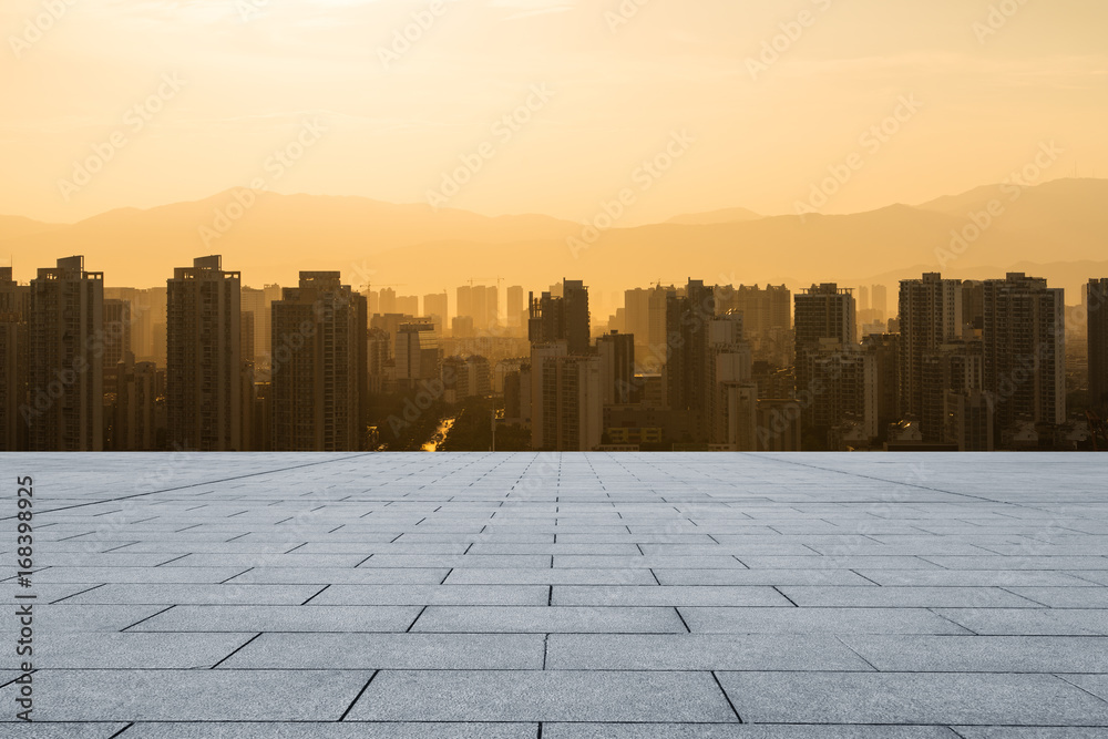 empty marble floor with cityscape and skyline at sunrise