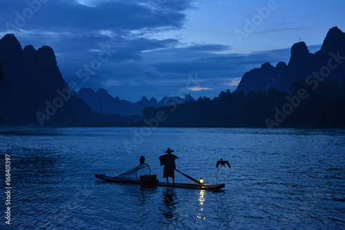 Fisherman and cormorant , Guangxi province, China