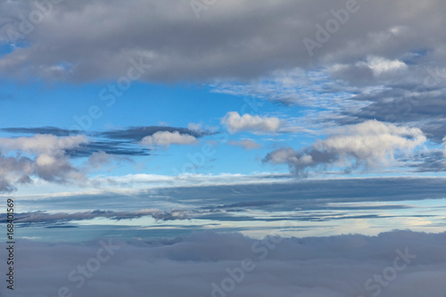 aerial of blue sky with dark raining clouds © travelview