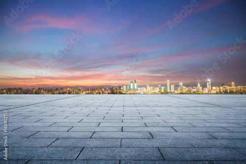 Empty floor with modern city skyline