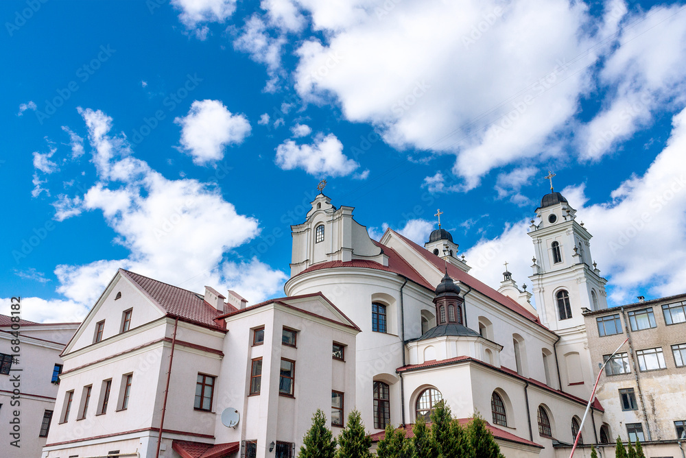 Cathedral of the blessed Virgin Mary at Minsk, Belarus. City landscape with blue sky and clouds.