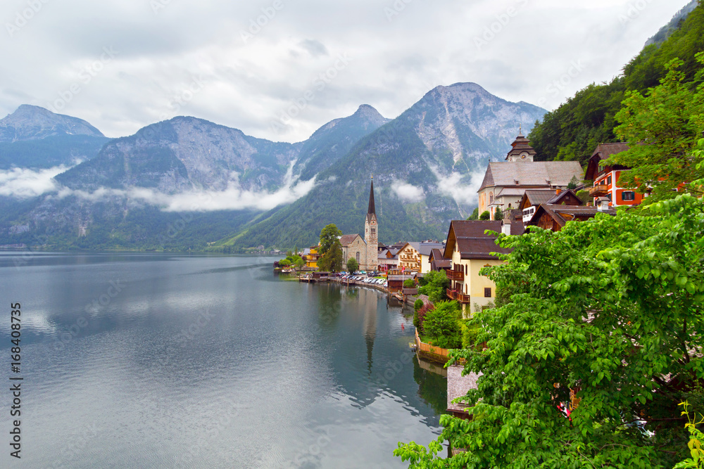 Hallstatt village in Alps at cloudy day, Austria