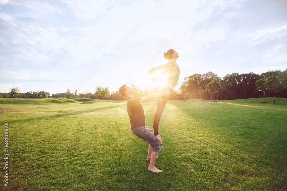 People practice acro yoga outdoors healthy lifestyle People practice acro yoga outdoors healthy lifestyle