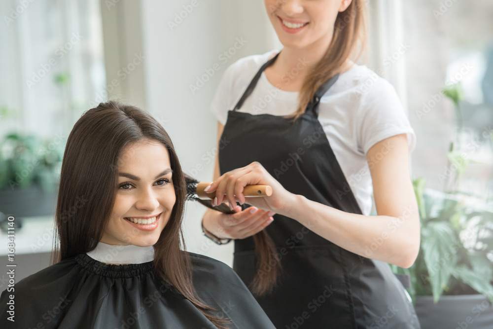 Young women sitting in beauty hair salon style Young women sitting in beauty hair salon style