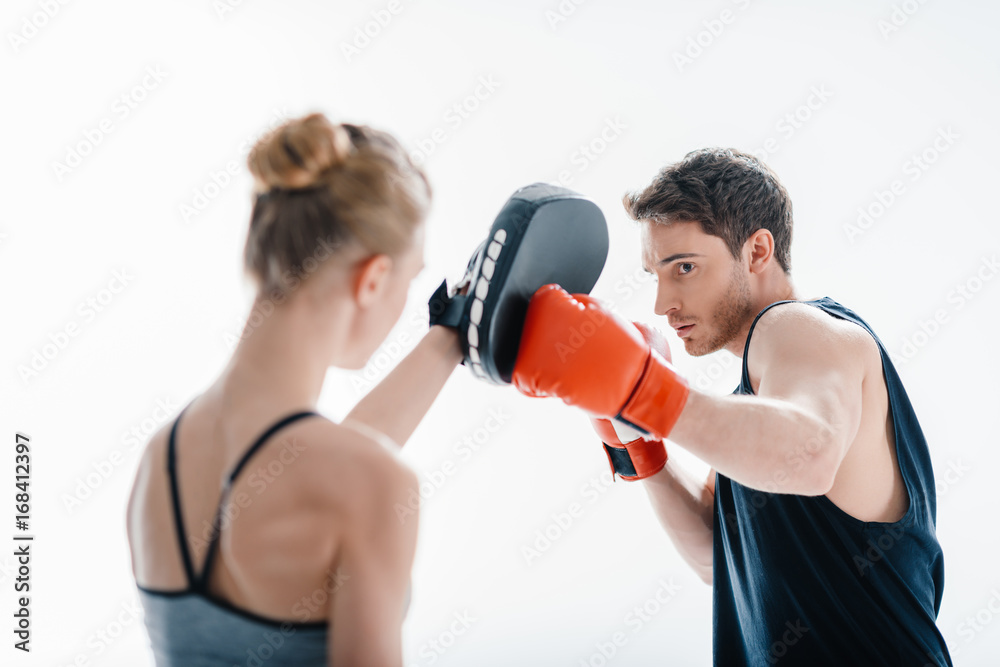 man boxing with female trainer man boxing with female trainer
