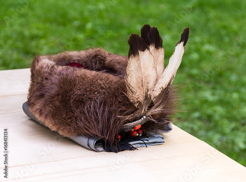 Bild auf Leinwand Traditional headdress fur nobleman's cap war is richly decorated with feathers a