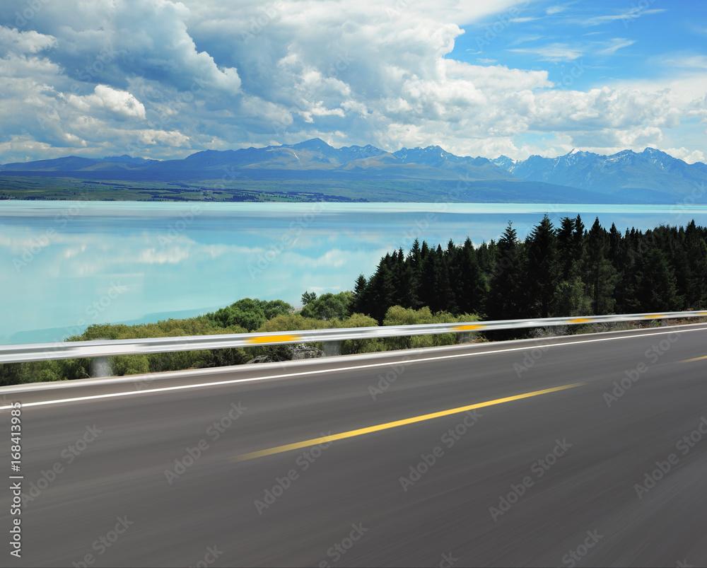Asphalt road with Lake Pukaki background Asphalt road with Lake Pukaki background