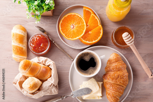 Breakfast with coffee, orange juice and croissant. Top view