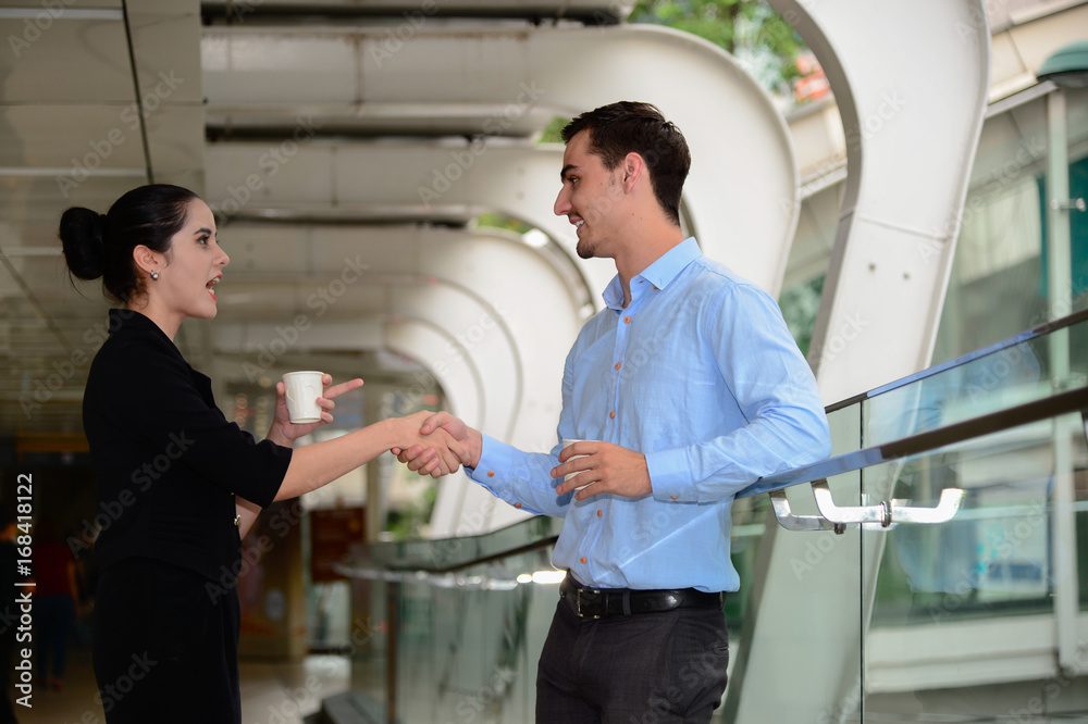 businessman and businesswoman shaking hands for success agreement and talk about business, outdoor businessman and businesswoman shaking hands for success agreement and talk about business, outdoor