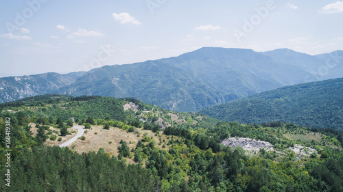 Fototapeta Naklejka Na Ścianę i Meble -  
High In The Mountains In Sunny Day Aerial Shot