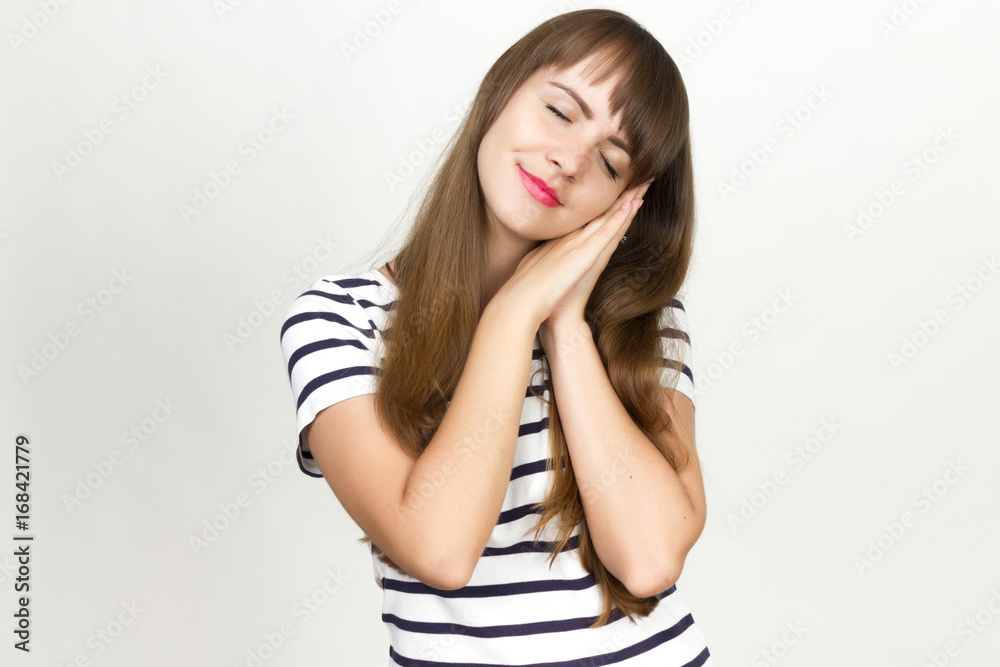 Portrait of a pretty woman pretends to be asleep in her arms Portrait of a pretty woman pretends to be asleep in her arms