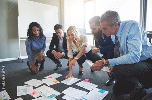 Men and woman brainstorming in office