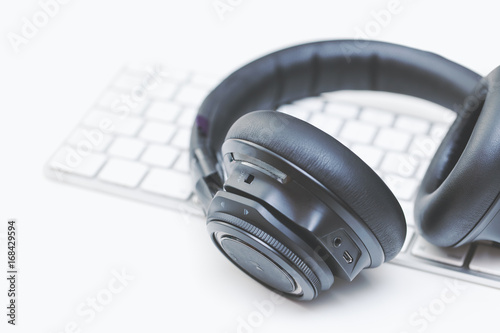 macro over-the-ear bluetooth headphones with active noise control on computer keyboard photo