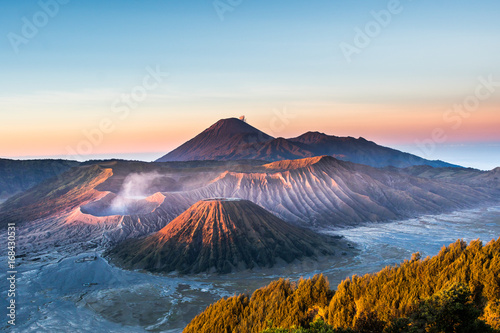 Mount Bromo volcano (Gunung Bromo) during sunrise from viewpoint on Mount Penanjakan, in East Java, Indonesia. photo