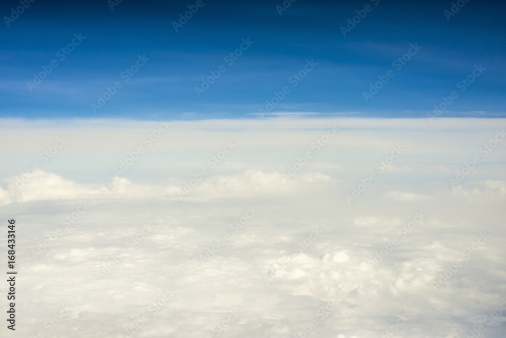 View over clouds from an airplane View over clouds from an airplane