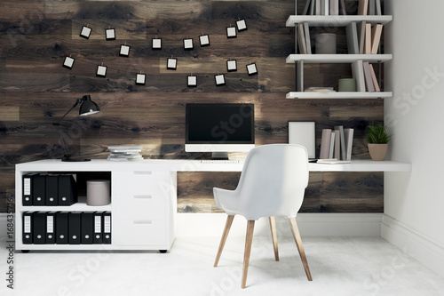 Dark wooden home office, white chair