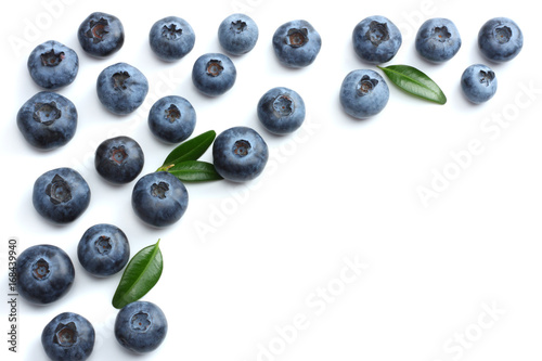 blueberries with green leaf isolated on white background