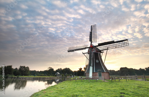 beautiful sunrise and Dutch windmill