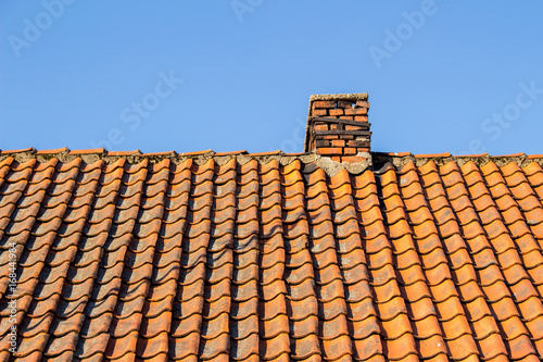 An old tiled roof © Sergey