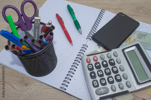 Calculator and money on wooden table. The concept of financial planning, savings