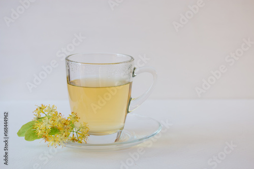 Linden tea in glass mug.