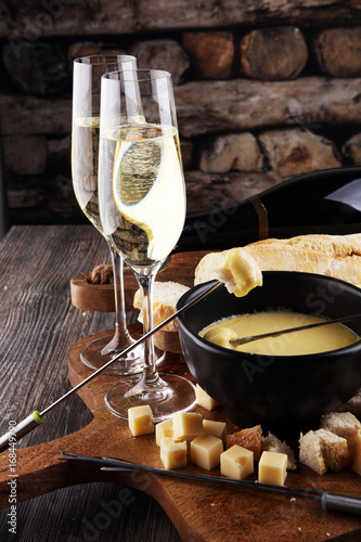 Photography Gourmet Swiss fondue dinner on a winter evening with assorted ch
