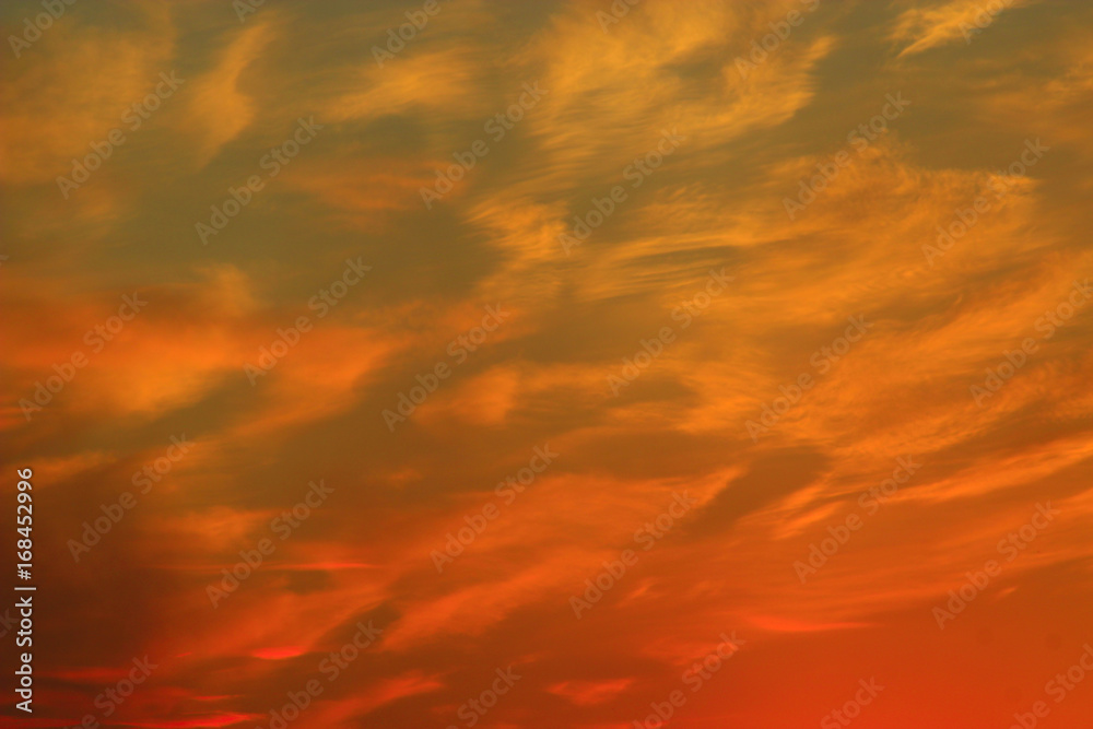 sunset with reddish yellow clouds
