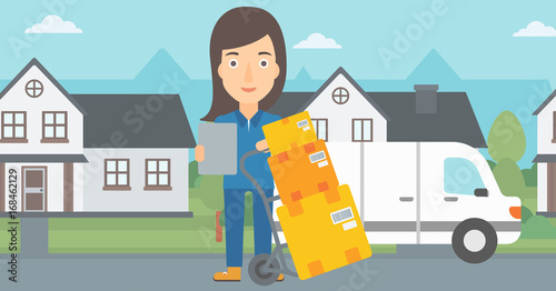 A delivery woman standing near cart with boxes and holding a file in a hand on the background of delivery truck and a house vector flat design illustration. Horizontal layout.