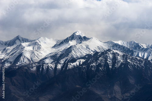 Dramatic mountain range and its peak in cloudy sky  Leh Ladakh  India