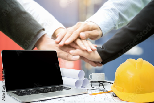 Workplace of architect,Engineering tools and handshake deal at construction site