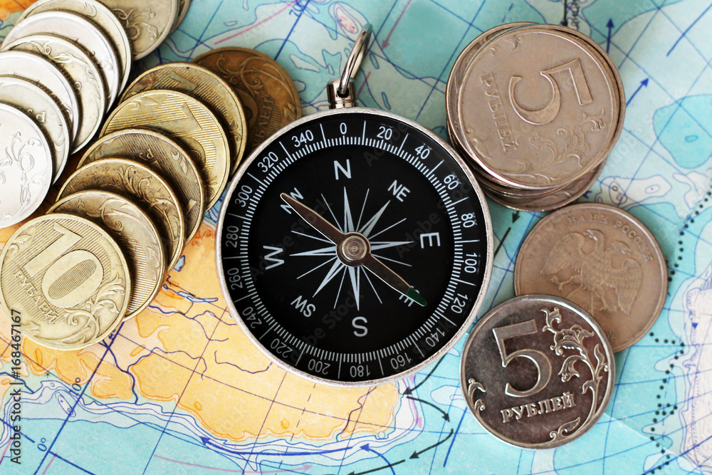 Compass and money on the map,a set of traveler