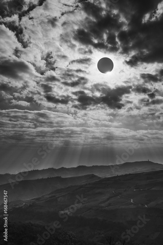 Scientific natural phenomenon. Total solar eclipse with diamond ring effect glowing on sky.