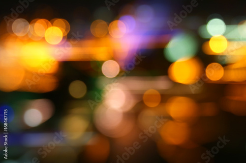 image of colorful blurred defocused bokeh Lights. motion and nightlife concept