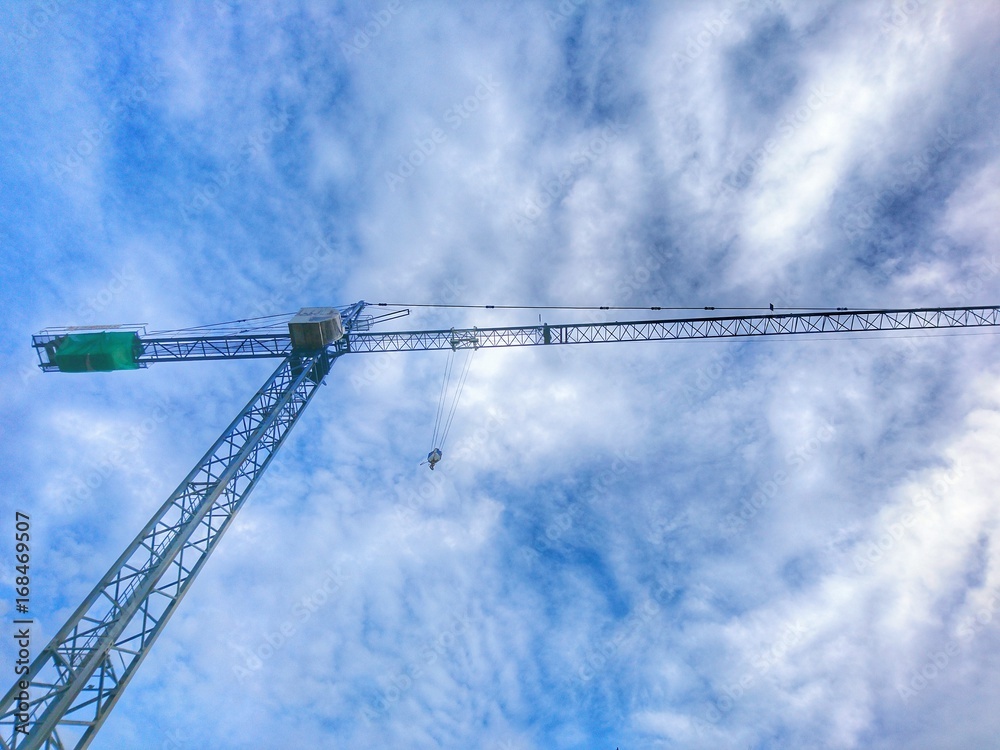 Construction crane with cloud and blue sky background Construction crane with cloud and blue sky background